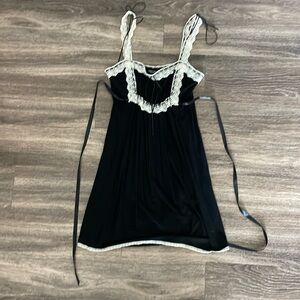 Betsey Johnson black mini dress with ivory lace and black ribbon details.